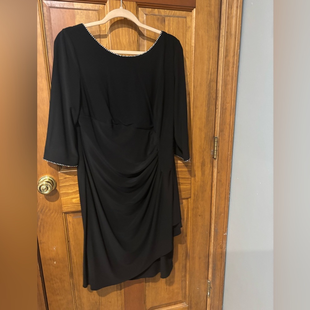 Lovely cocktail dress with subtle rhinestone beading at neck and sleeves.